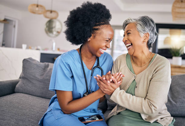 Caregiver and client side-by-side at home